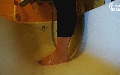 Young Girl Washing And Brushing Her Bare Feet